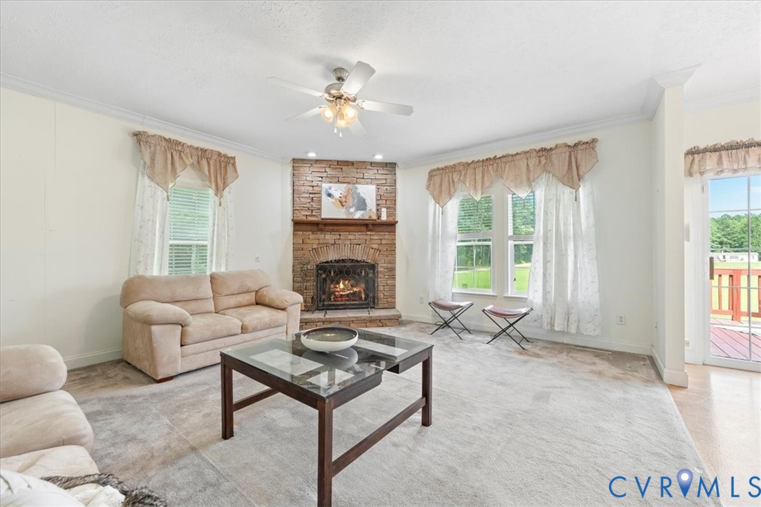 28231 Lewis Moore Road Ruther Glen, VA 22546 - Photo 17 of 50 a living room with furniture and a fireplace