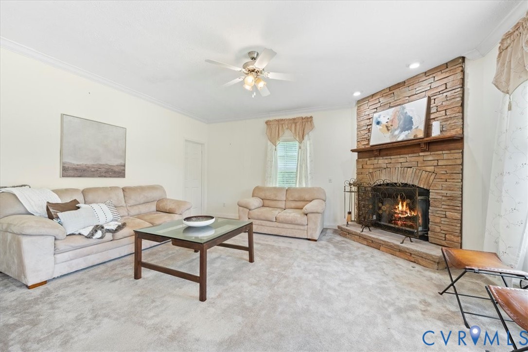 28231 Lewis Moore Road Ruther Glen, VA 22546 - Photo 18 of 50 a living room with furniture and a fireplace