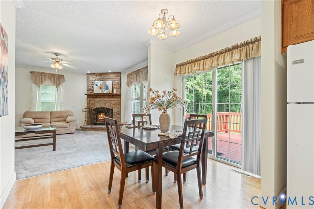 28231 Lewis Moore Road Ruther Glen, VA 22546 - Photo 2 of 50 a view of a dining room with furniture window and wooden floor