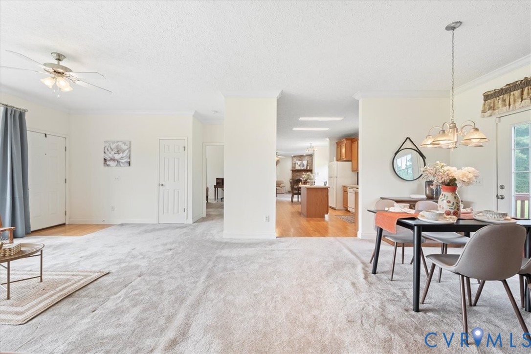 28231 Lewis Moore Road Ruther Glen, VA 22546 - Photo 21 of 50 a view of a livingroom and a dining room with wooden floor