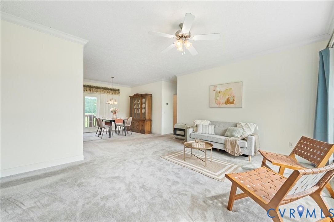 28231 Lewis Moore Road Ruther Glen, VA 22546 - Photo 22 of 50 a living room with furniture and a table