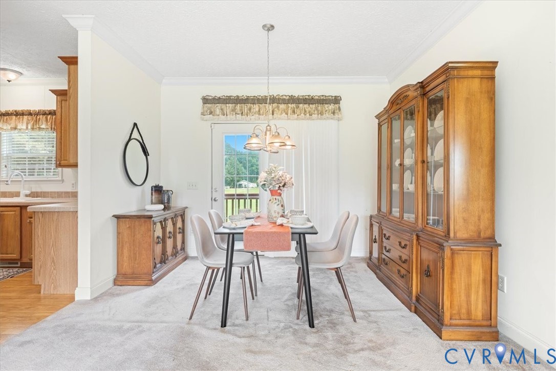 28231 Lewis Moore Road Ruther Glen, VA 22546 - Photo 23 of 50 a view of a room with furniture and a window