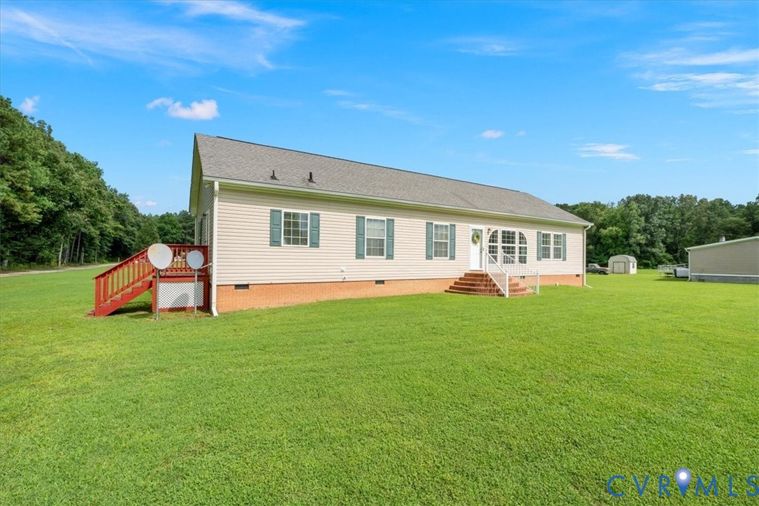 28231 Lewis Moore Road Ruther Glen, VA 22546 - Photo 4 of 50 a view of a house with backyard and porch