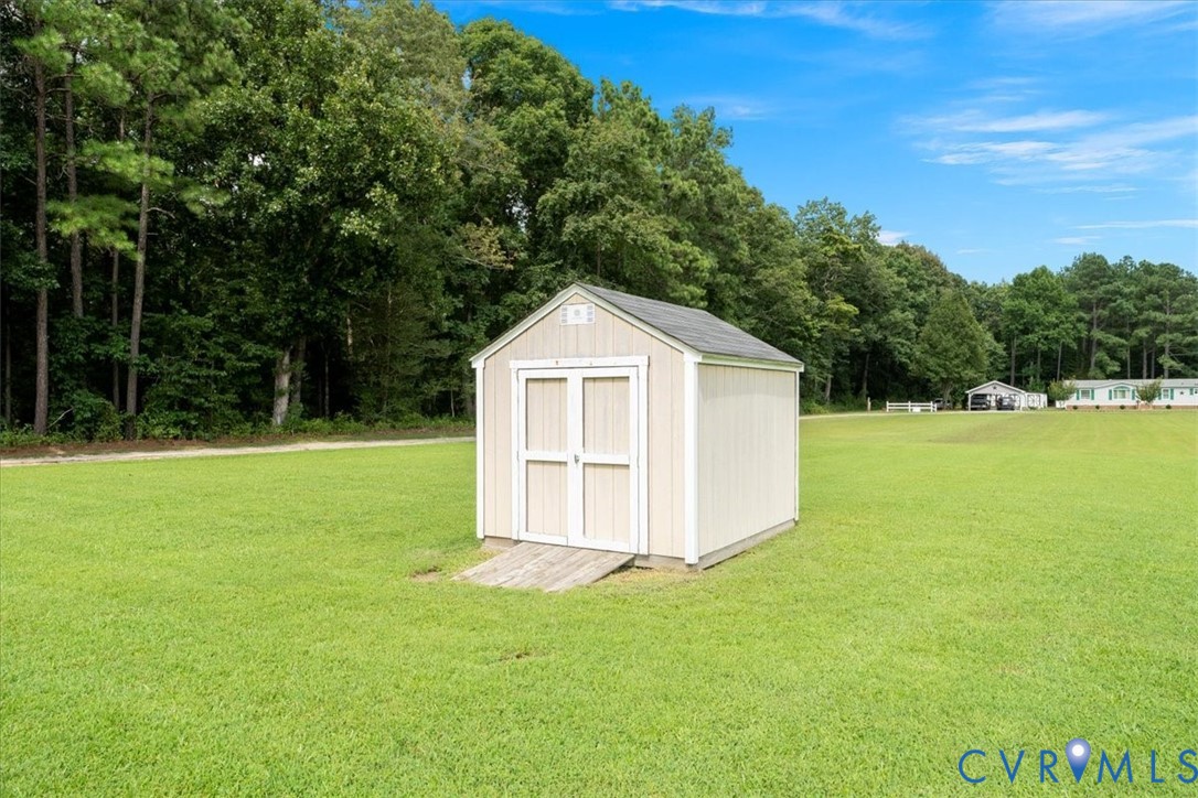 28231 Lewis Moore Road Ruther Glen, VA 22546 - Photo 41 of 50 a view of a house with backyard
