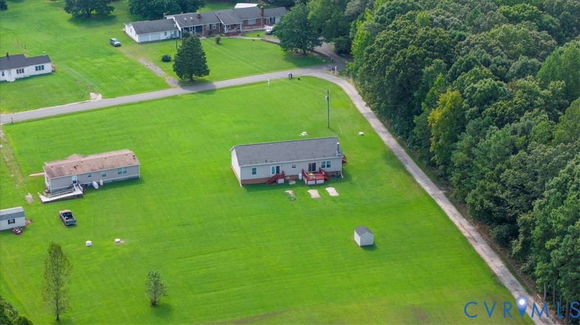 28231 Lewis Moore Road Ruther Glen, VA 22546 - Photo 42 of 50 a green field with lots of trees