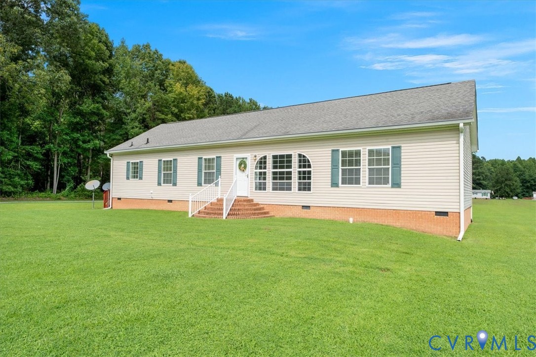 28231 Lewis Moore Road Ruther Glen, VA 22546 - Photo 6 of 50 a view of a house with a backyard