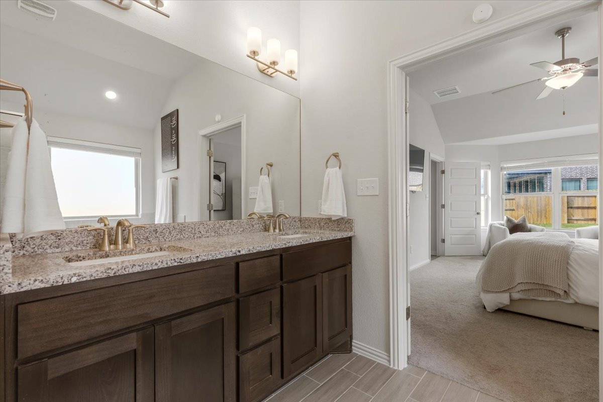 366 Cold Riv Run Kyle, TX 78640 - Photo 15 of 31 Dual vanity with a granite countertop and under-mount sinks