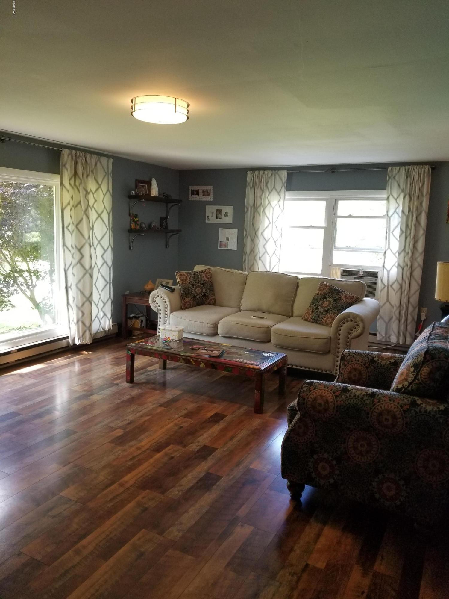 144 Mid Valley Road Lake Ariel, PA 18436 - Photo 27 of 55 a living room with furniture and a large window