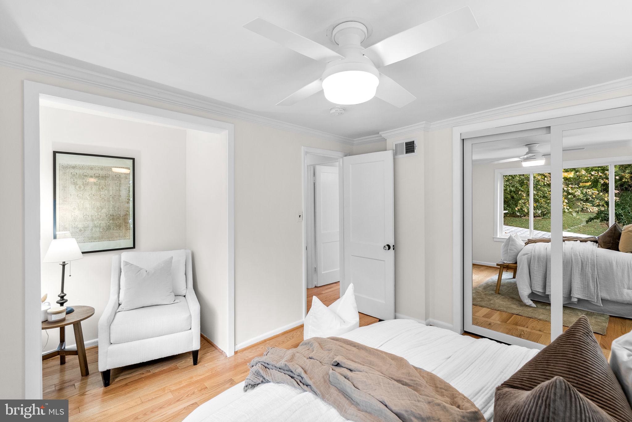 725 Silver Spring Avenue Silver Spring, MD 20910 - Photo 16 of 41 a bedroom with furniture and a large mirror