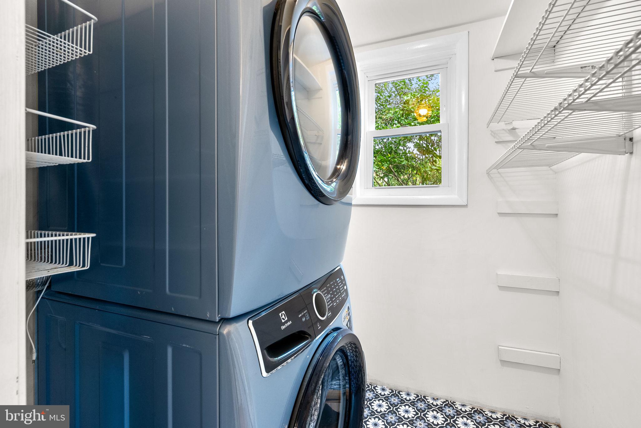 725 Silver Spring Avenue Silver Spring, MD 20910 - Photo 23 of 41 a bathroom with a sink a toilet and a mirror