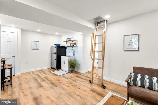 a bedroom with a bed and a chair