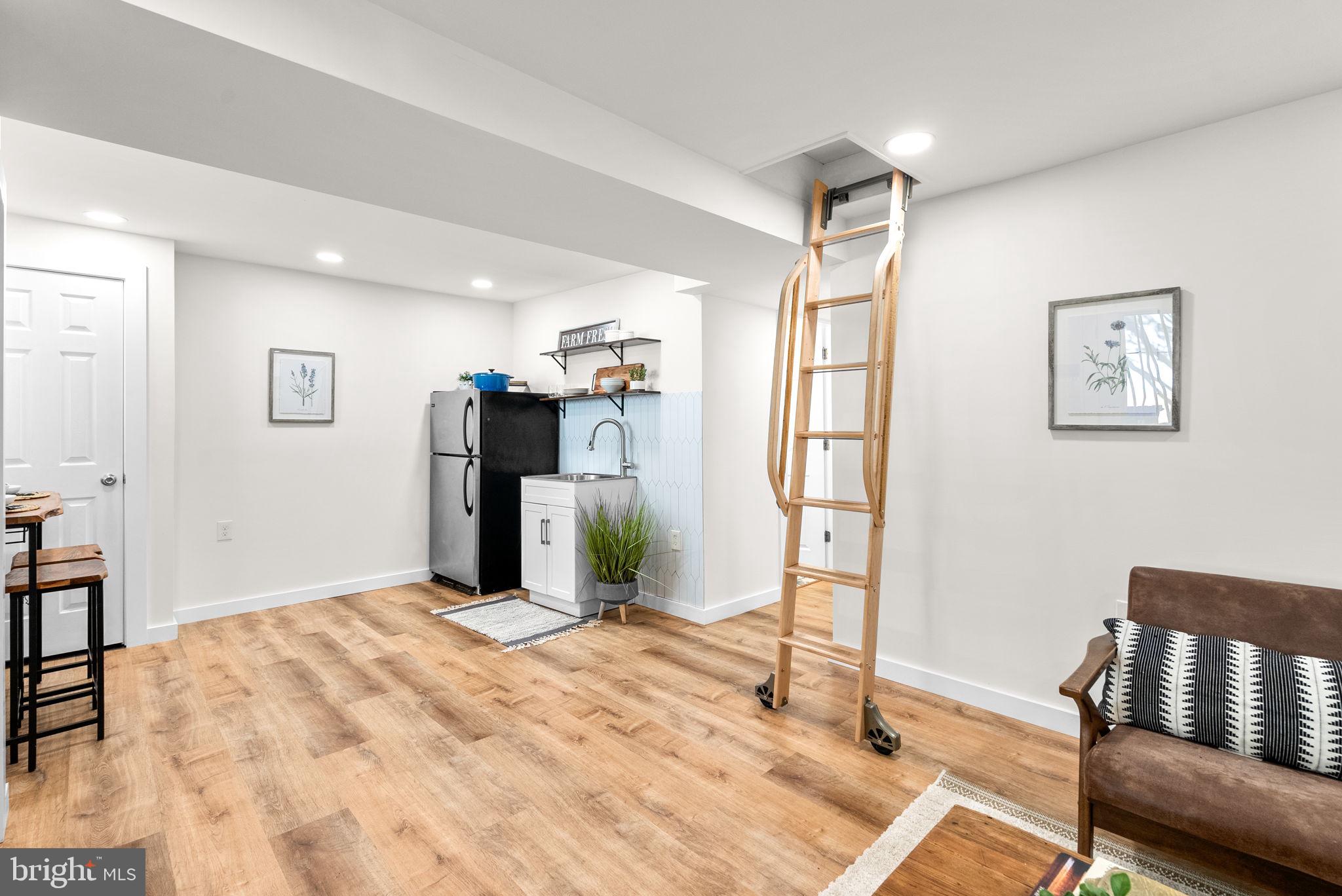 725 Silver Spring Avenue Silver Spring, MD 20910 - Photo 25 of 41 a bedroom with a bed and a chair