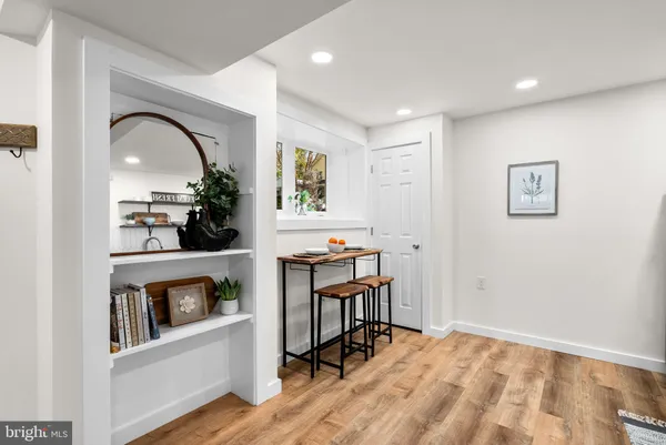 a view of a livingroom with furniture and a kitchen