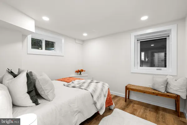 a bedroom with a bed and a couch