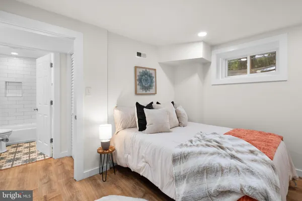 a bedroom with a bed and a view of bedroom