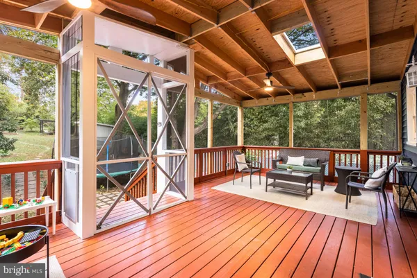 a view of balcony with chairs and wooden floor