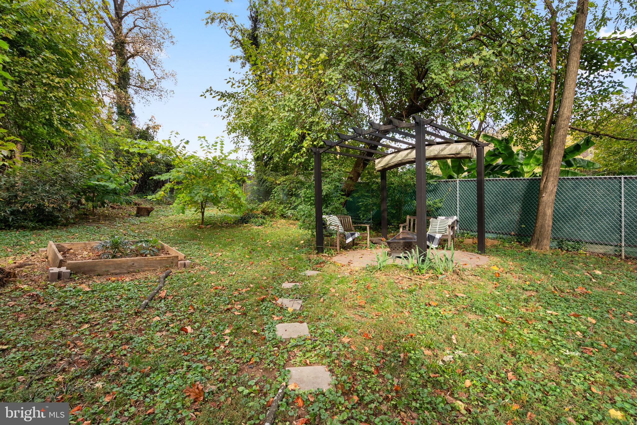725 Silver Spring Avenue Silver Spring, MD 20910 - Photo 35 of 41 a backyard of a house with table and chairs