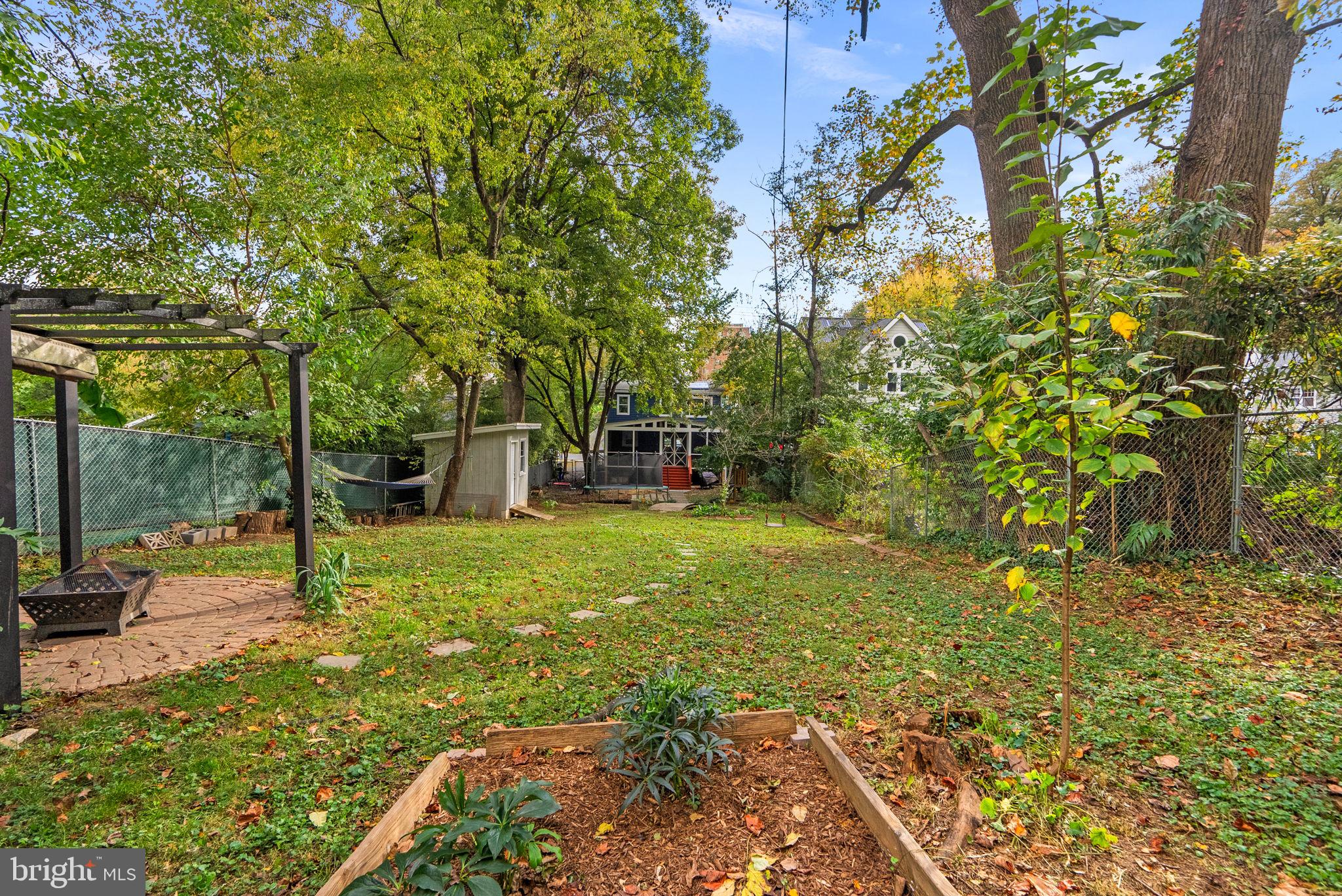 725 Silver Spring Avenue Silver Spring, MD 20910 - Photo 36 of 41 a backyard of a house with table and chairs