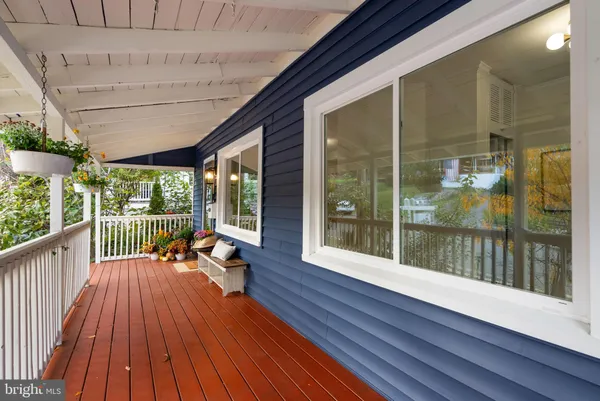 a view of a balcony with wooden floor