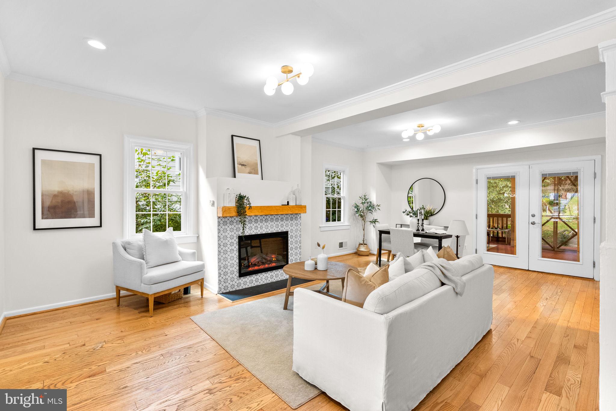 725 Silver Spring Avenue Silver Spring, MD 20910 - Photo 6 of 41 a living room with furniture and a fireplace