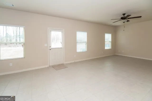 an empty room with windows