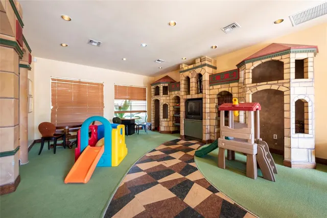 a living room with furniture pool and a table