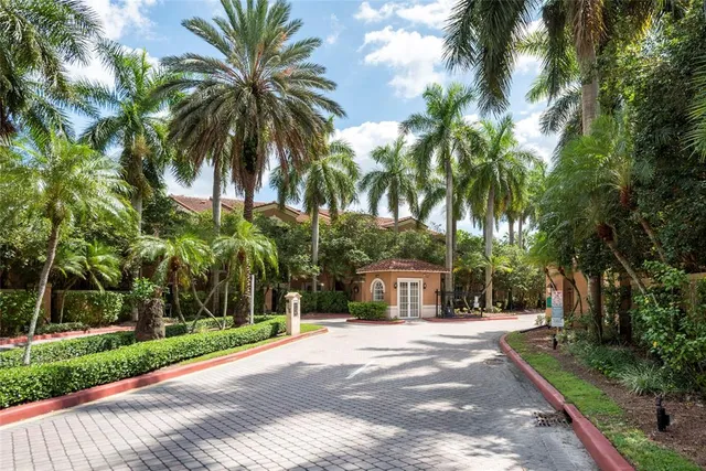 a house with palm tree in front of it