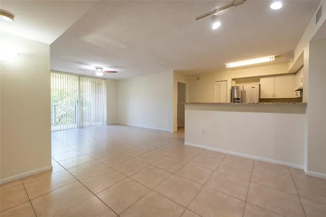 a view of a kitchen with a sink and cabinets