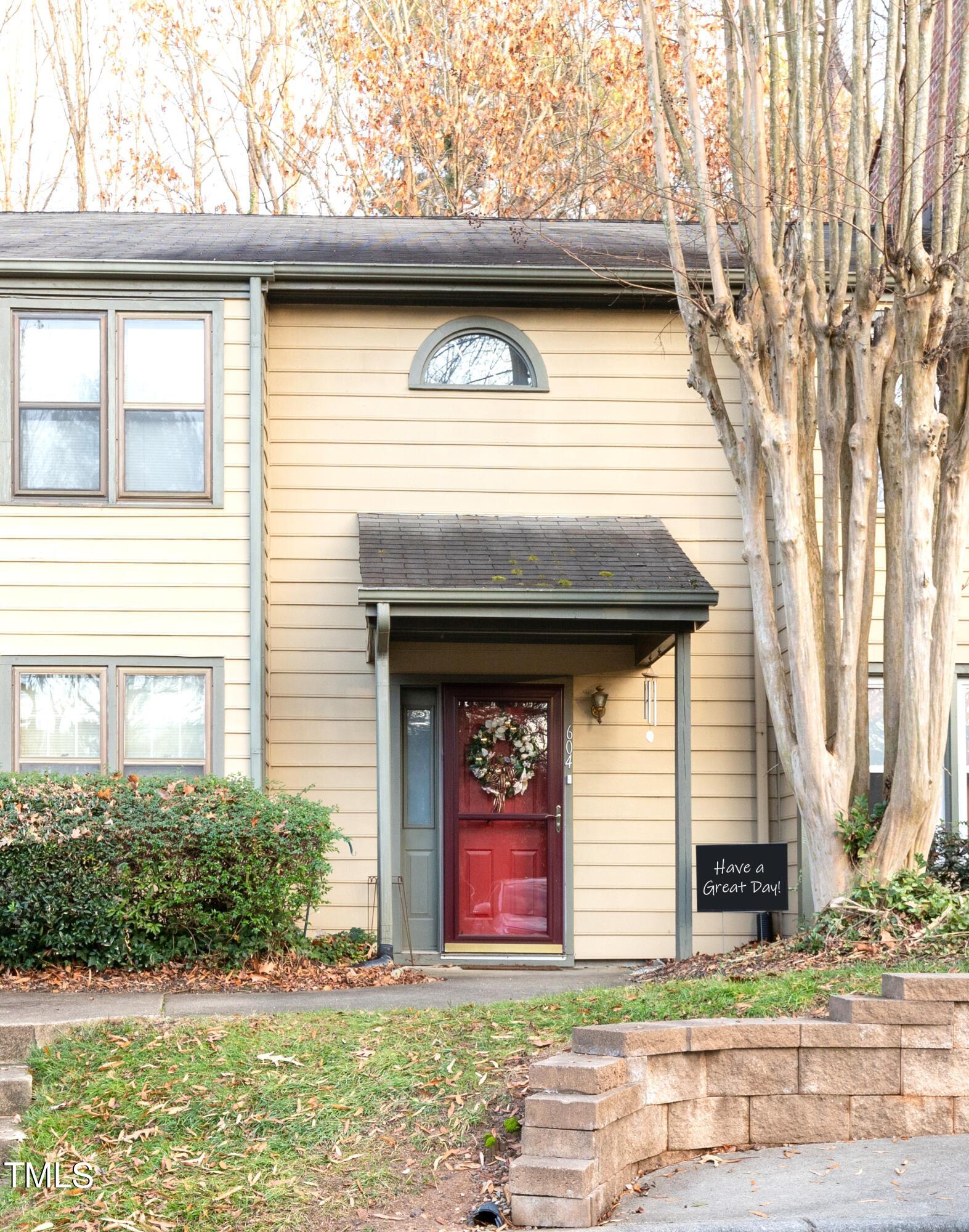 604 Broad Leaf Circle Raleigh, NC 27613 - Photo 1 of 23 a front view of a house with garden