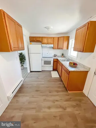 a bedroom with a bed and painting on the wall