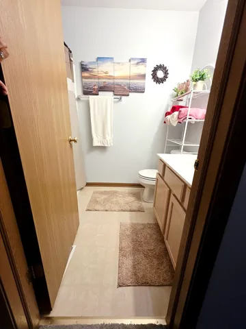 view of a room with wooden floor washer and dryer
