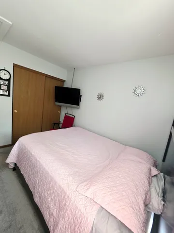 a bedroom with a bedroom and a bed