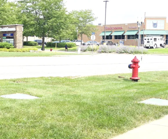 a swimming pool with outdoor seating and yard