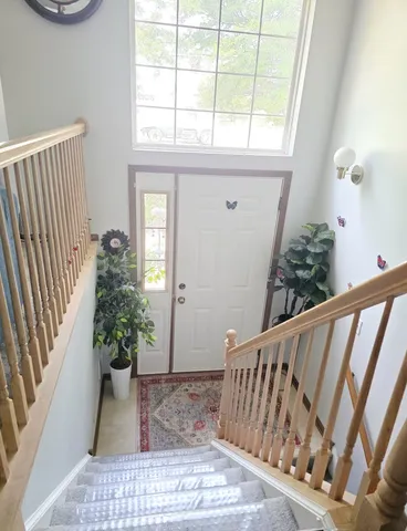 a view of stairs and wooden floor