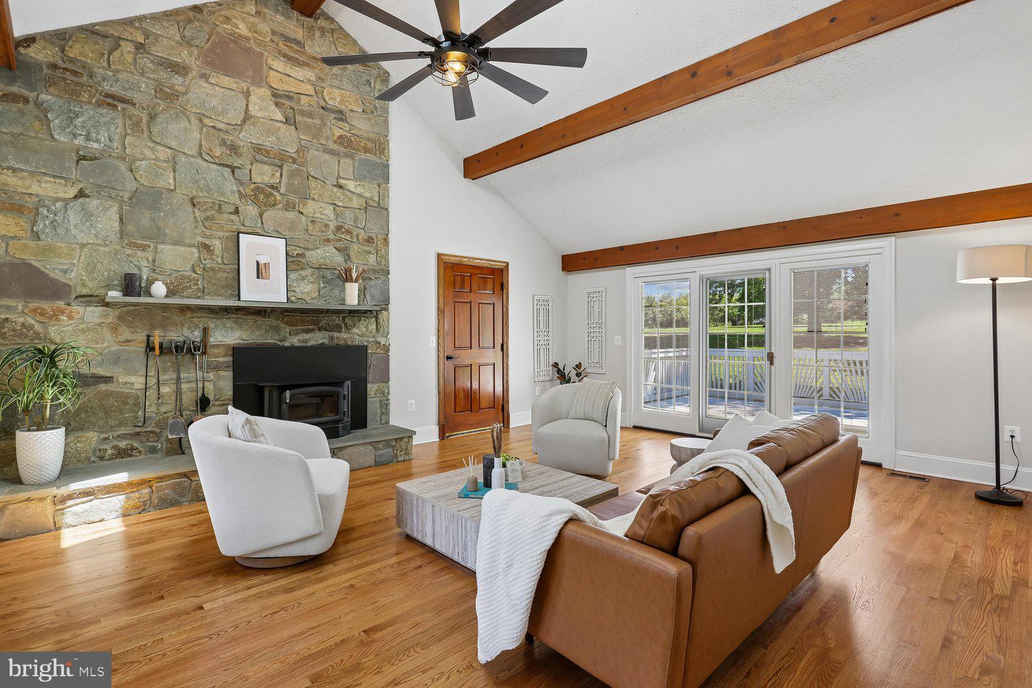 20920 Sunnyacres Road Gaithersburg, MD 20882 - Photo 21 of 64 Family room with floor-to-ceiling stone fireplace