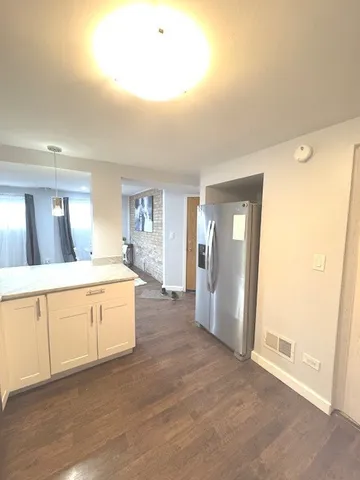 a bathroom with a toilet a sink and bathtub