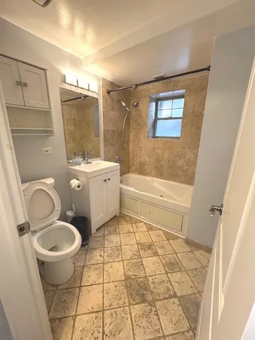 a bedroom with a bed and lamp