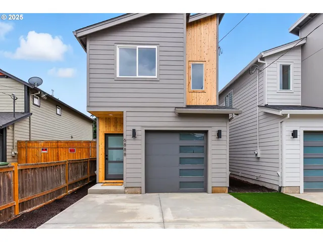 a view of a house with a garage
