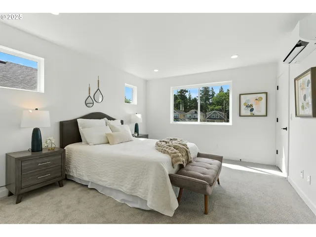 a bedroom with a bed and a table