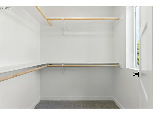 a view of an empty walk in closet