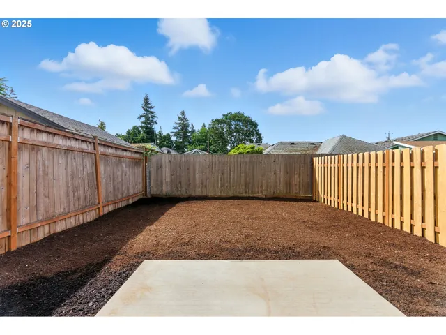 a view of outdoor space with wooden fence