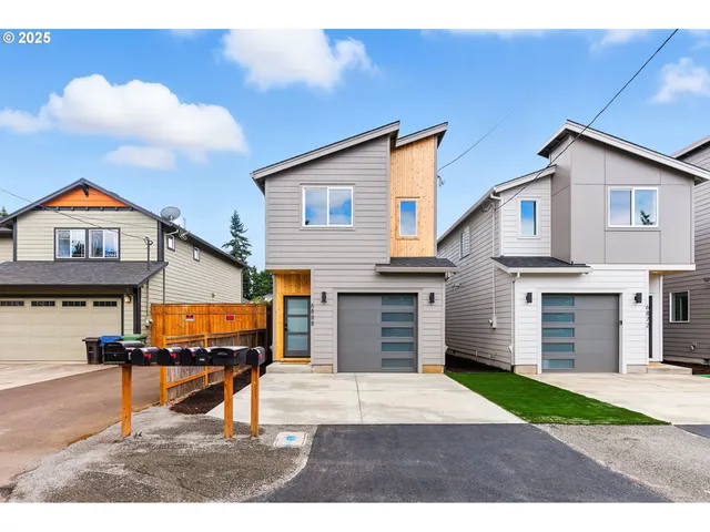 a backyard of a house with yard fire pit and barbeque oven