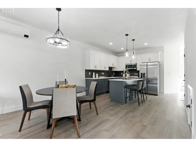 a view of kitchen with dining table and chairs