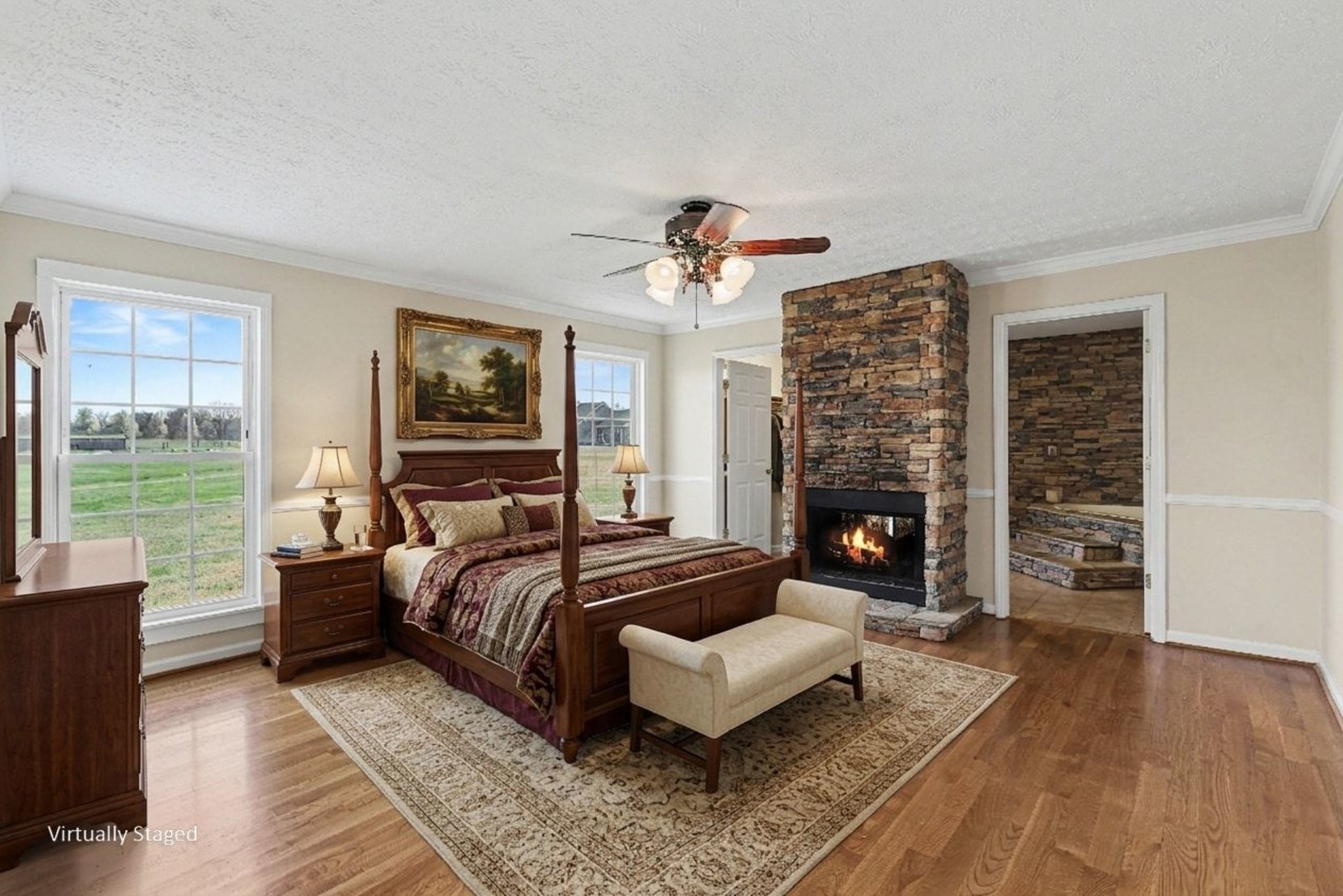 863 Rock Springs Road Castalian Springs, TN 37031 - Photo 18 of 36 a spacious bedroom with a bed and a couch