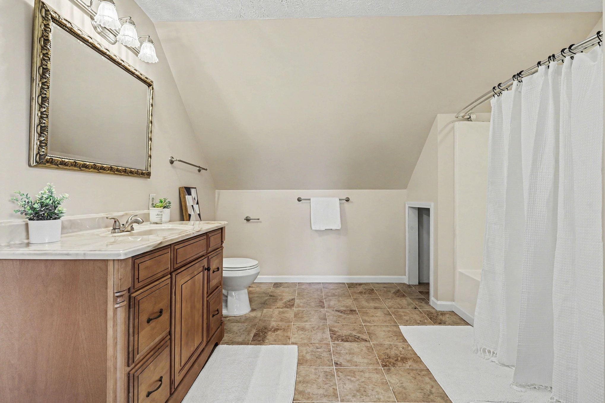 863 Rock Springs Road Castalian Springs, TN 37031 - Photo 24 of 36 a bathroom with a sink a toilet and a mirror
