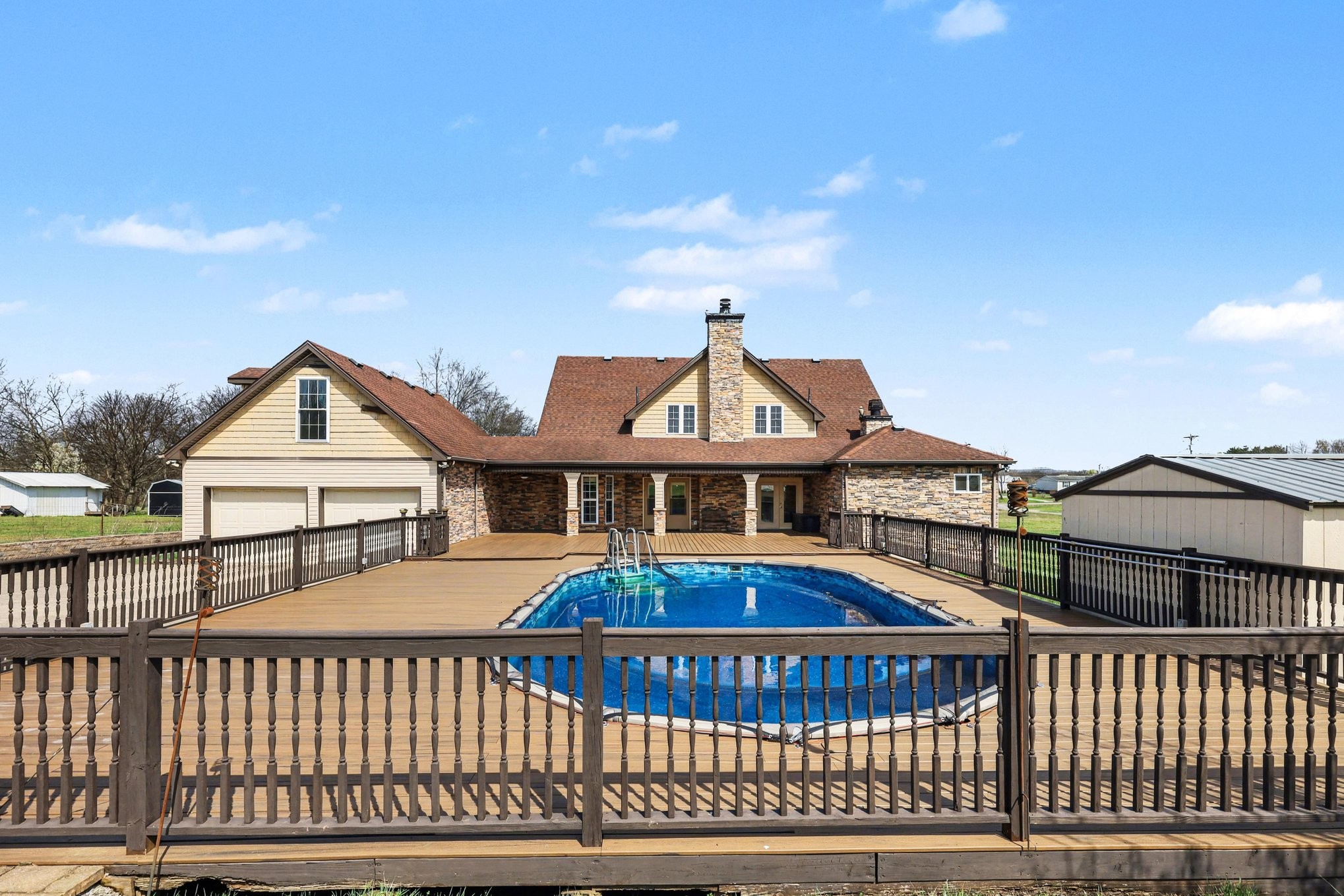 863 Rock Springs Road Castalian Springs, TN 37031 - Photo 32 of 36 a view of a white house with a roof deck