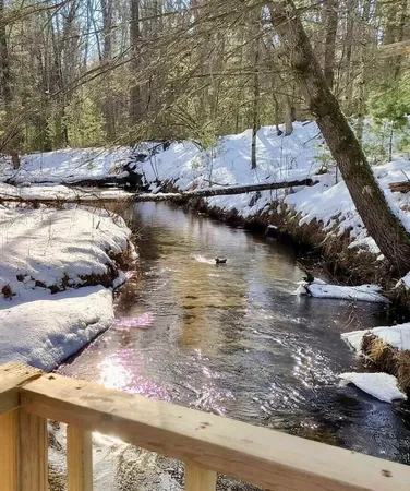 $349,900 | 3833 East Creek Wood Drive, Chase, MI 49623