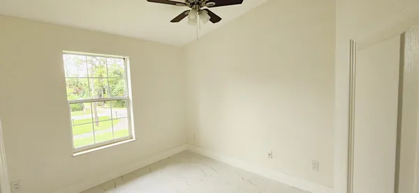 a view of a window in an empty room