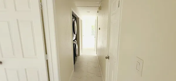 a bathroom with a shower and a glass door