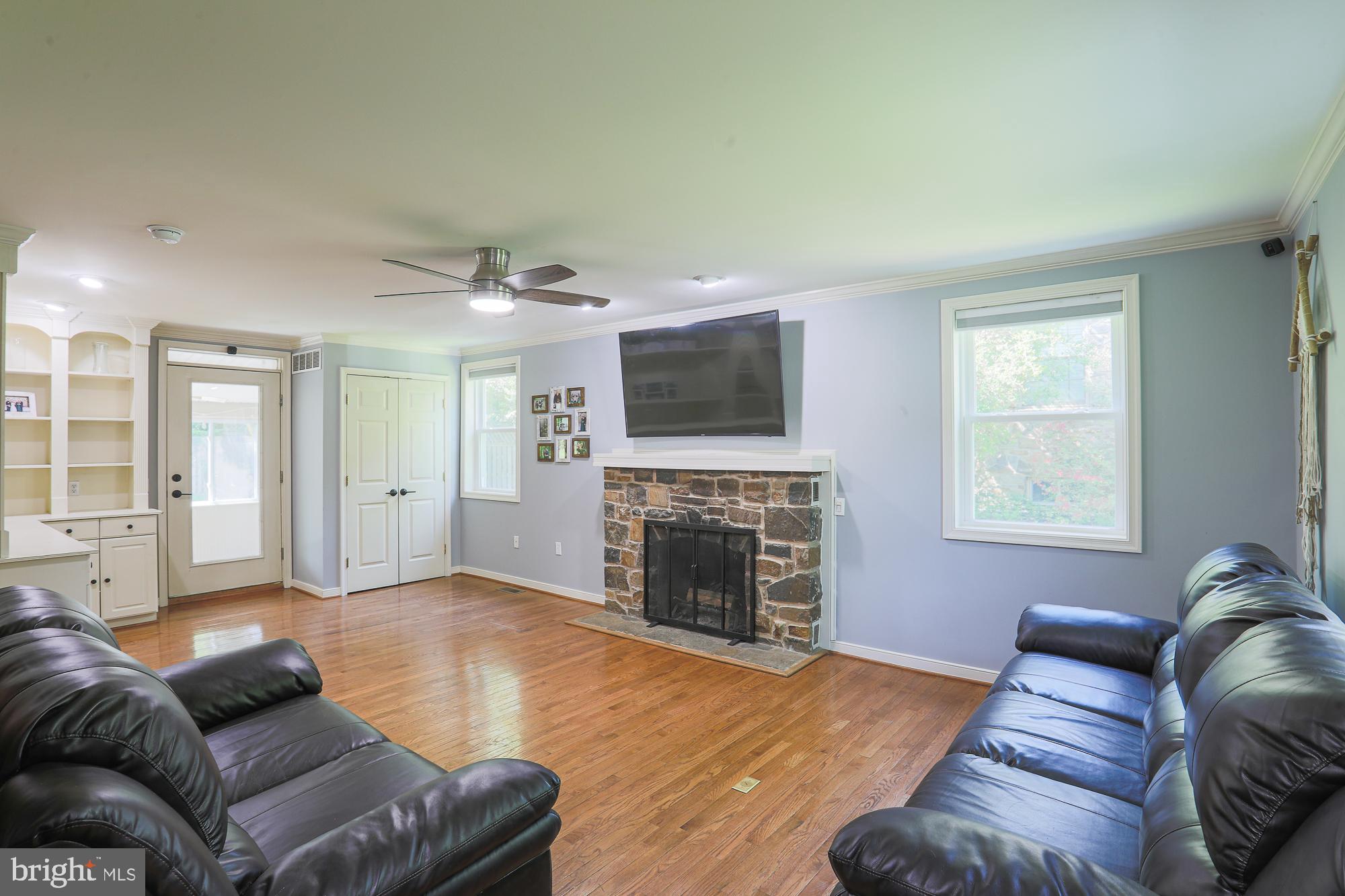 2509 Pinebrush Road Baltimore, MD 21209 - Photo 2 of 20 a living room with furniture and a fireplace